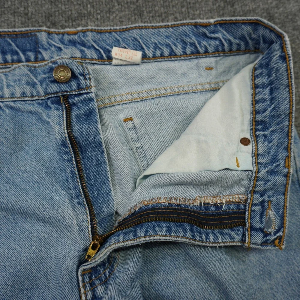 Vintage Levis 550 Relaxed Fit Tapered Mens Light Wash Orange Tab Jeans 34x32 90s